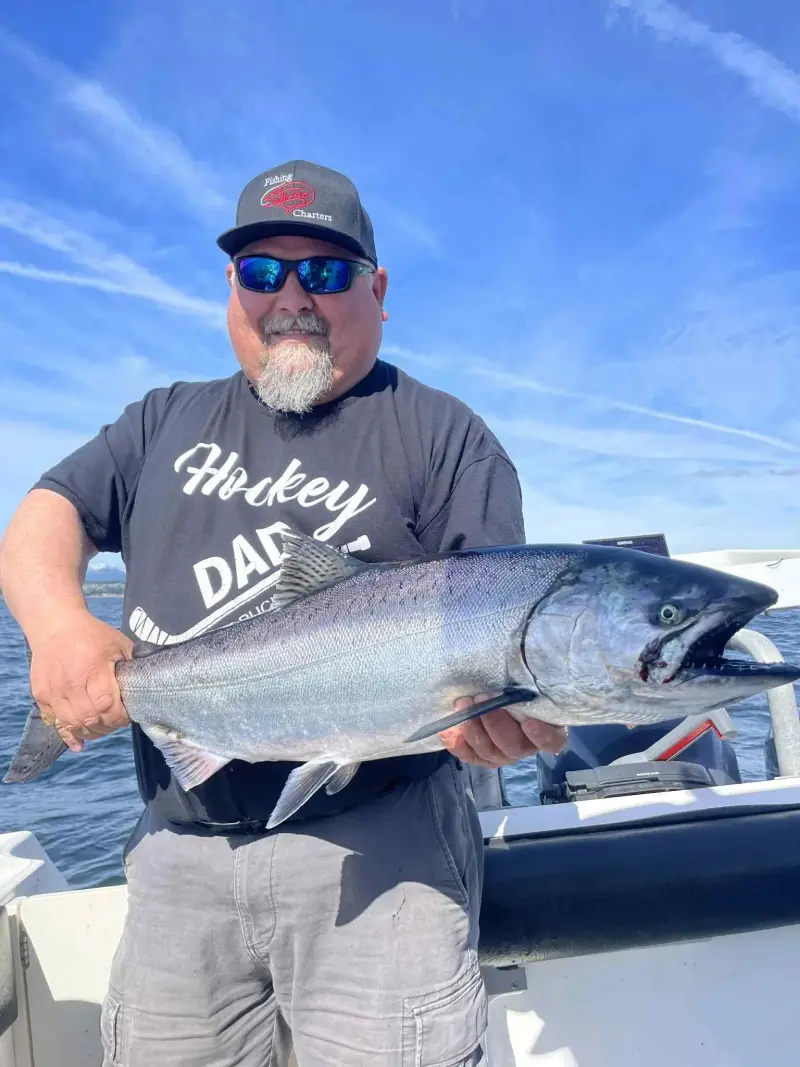 Campbell River fishing guide Captain Norm holding 40-pound trophy Chinook salmon