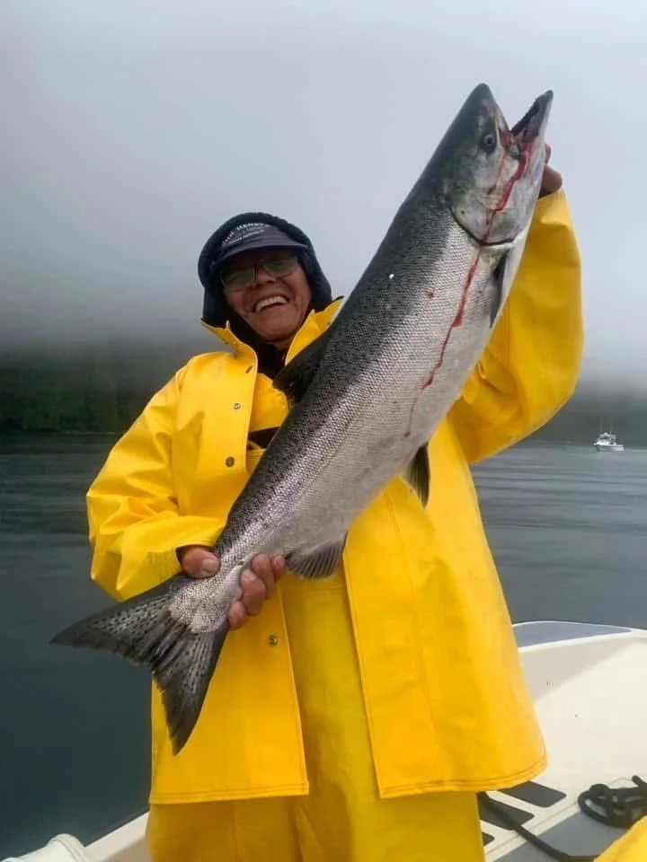 Angler with Chinook in Yellow Rain Gear