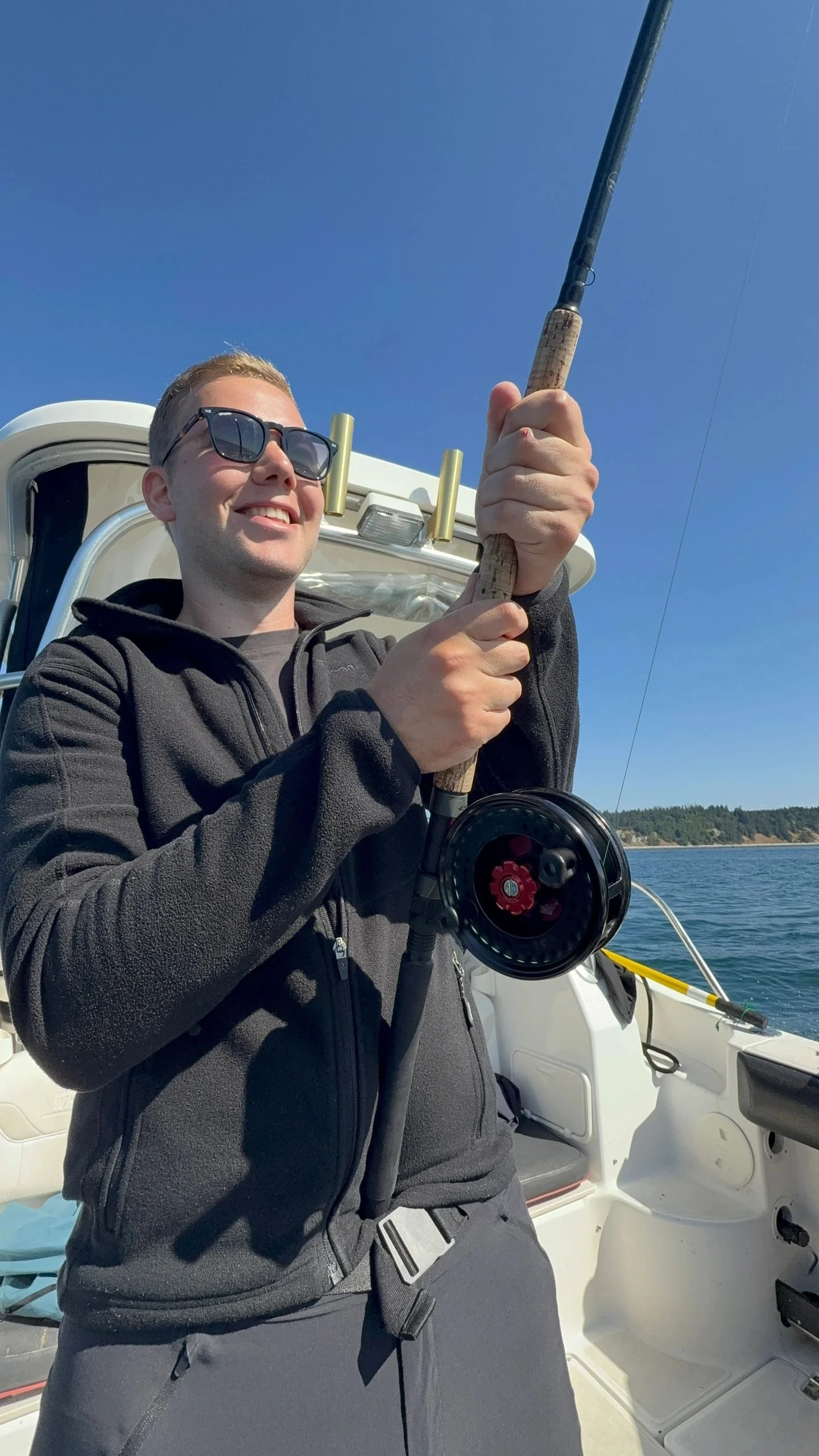 Angler Fighting Fish with Mooching Reel