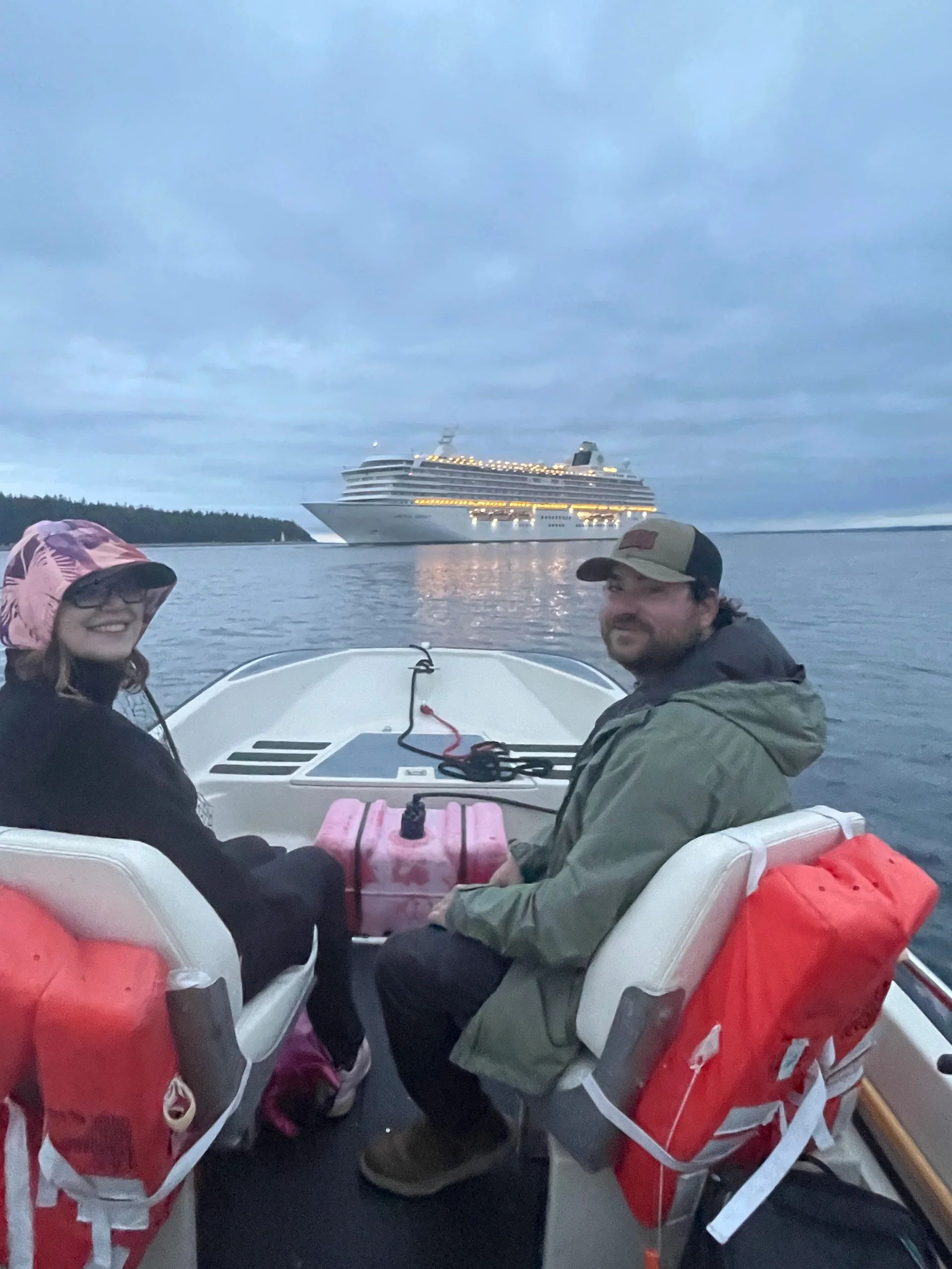 Couple on Boat with Cruise Ship Background
