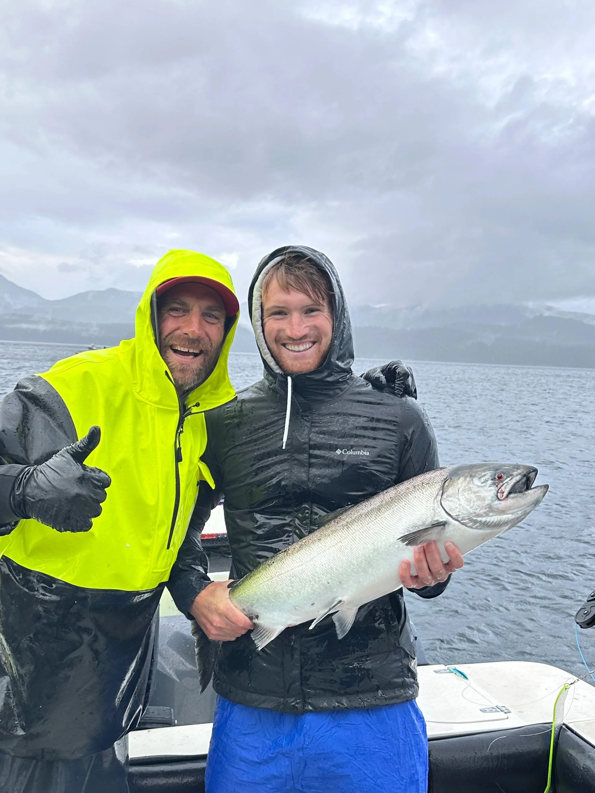 Friends with Salmon in Rain Gear