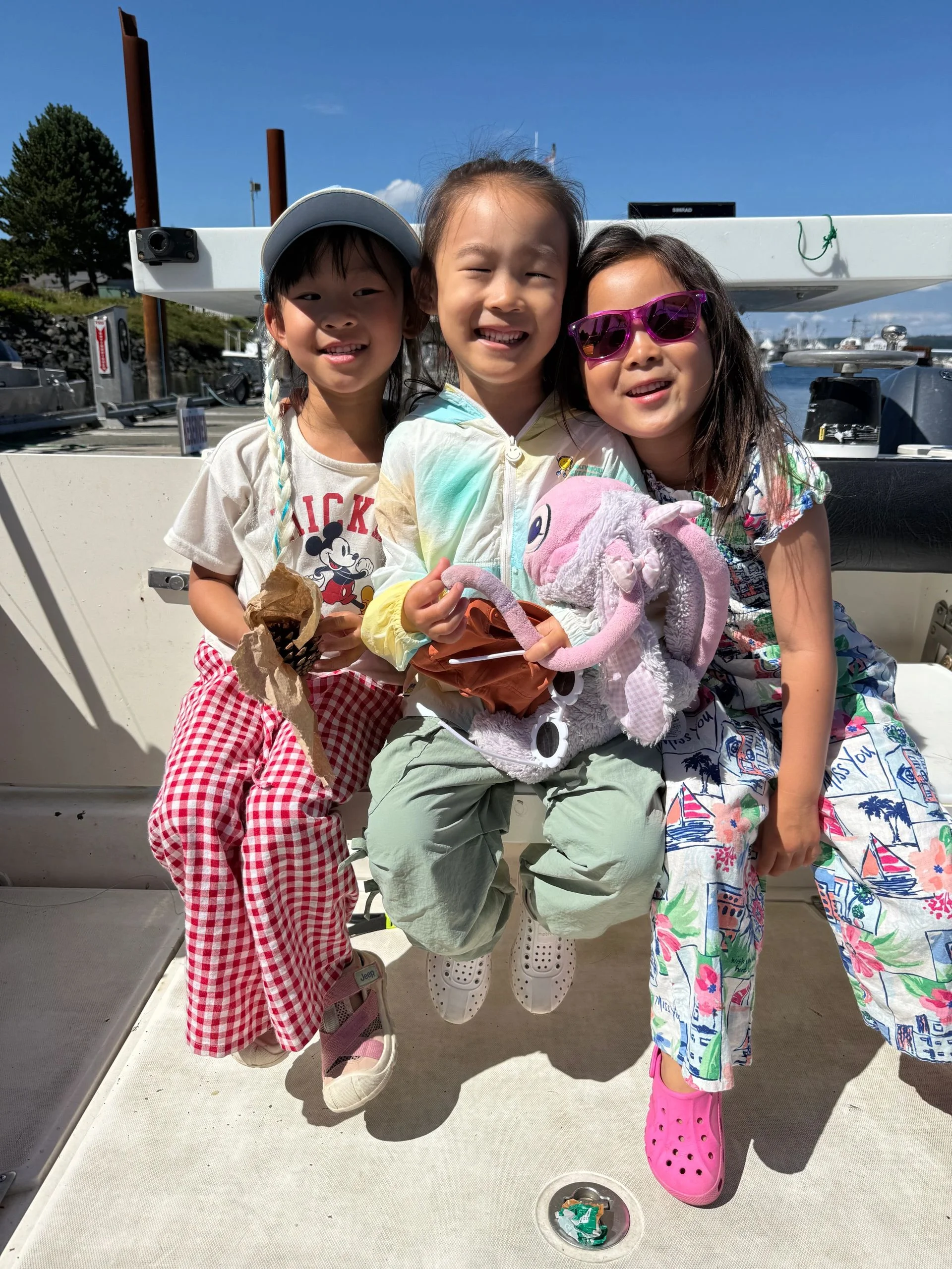 Three Girls on Boat at Marina